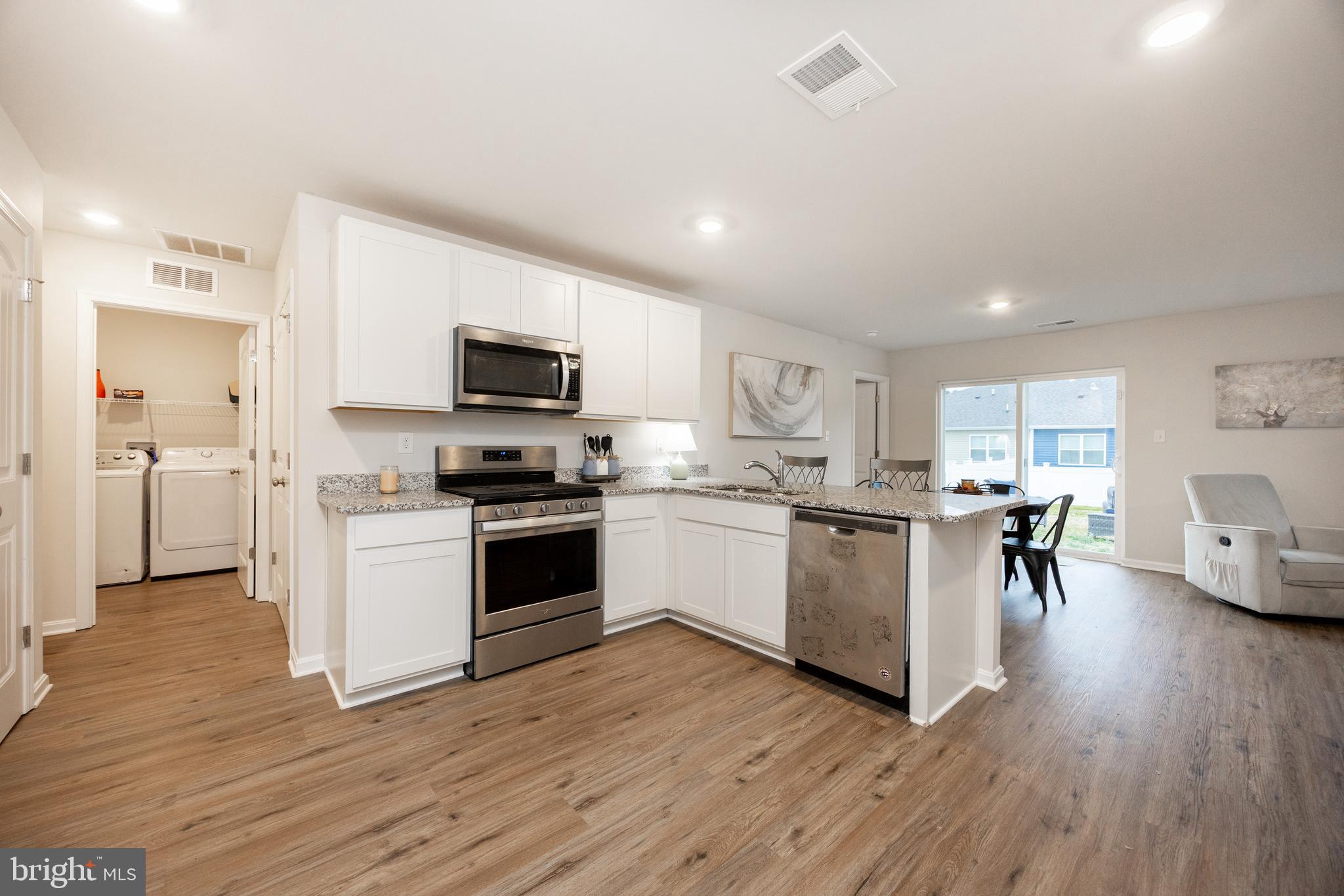 21 Clipper Street Smyrna, DE 19977 - Photo 13 of 39 a kitchen with a sink and a stove top oven