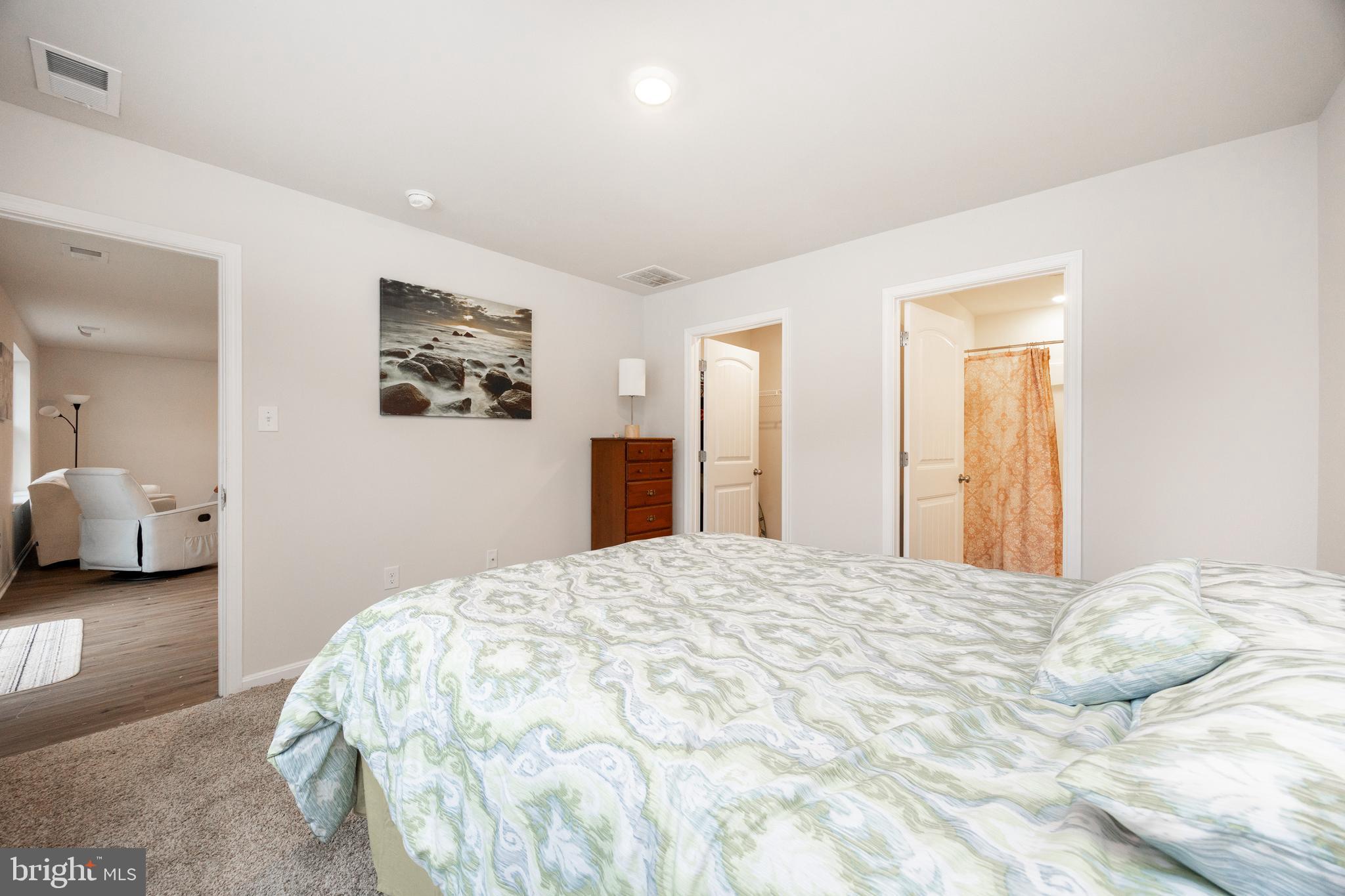 21 Clipper Street Smyrna, DE 19977 - Photo 17 of 39 a bedroom with a bed and a large mirror