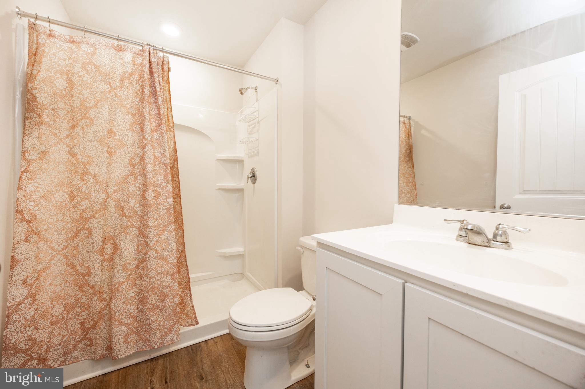 21 Clipper Street Smyrna, DE 19977 - Photo 19 of 39 a bathroom with a sink a toilet and shower