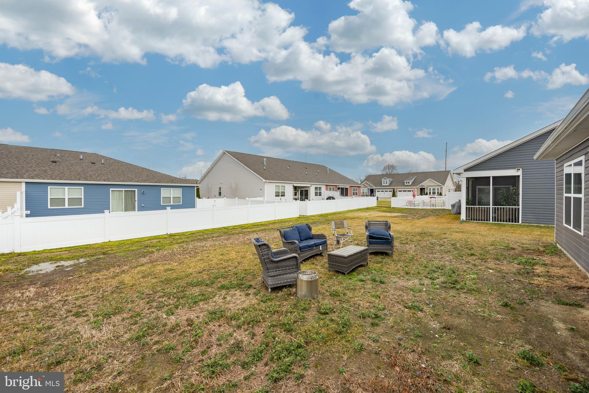 21 Clipper Street Smyrna, DE 19977 - Photo 28 of 39 a backyard of a house with table and chairs