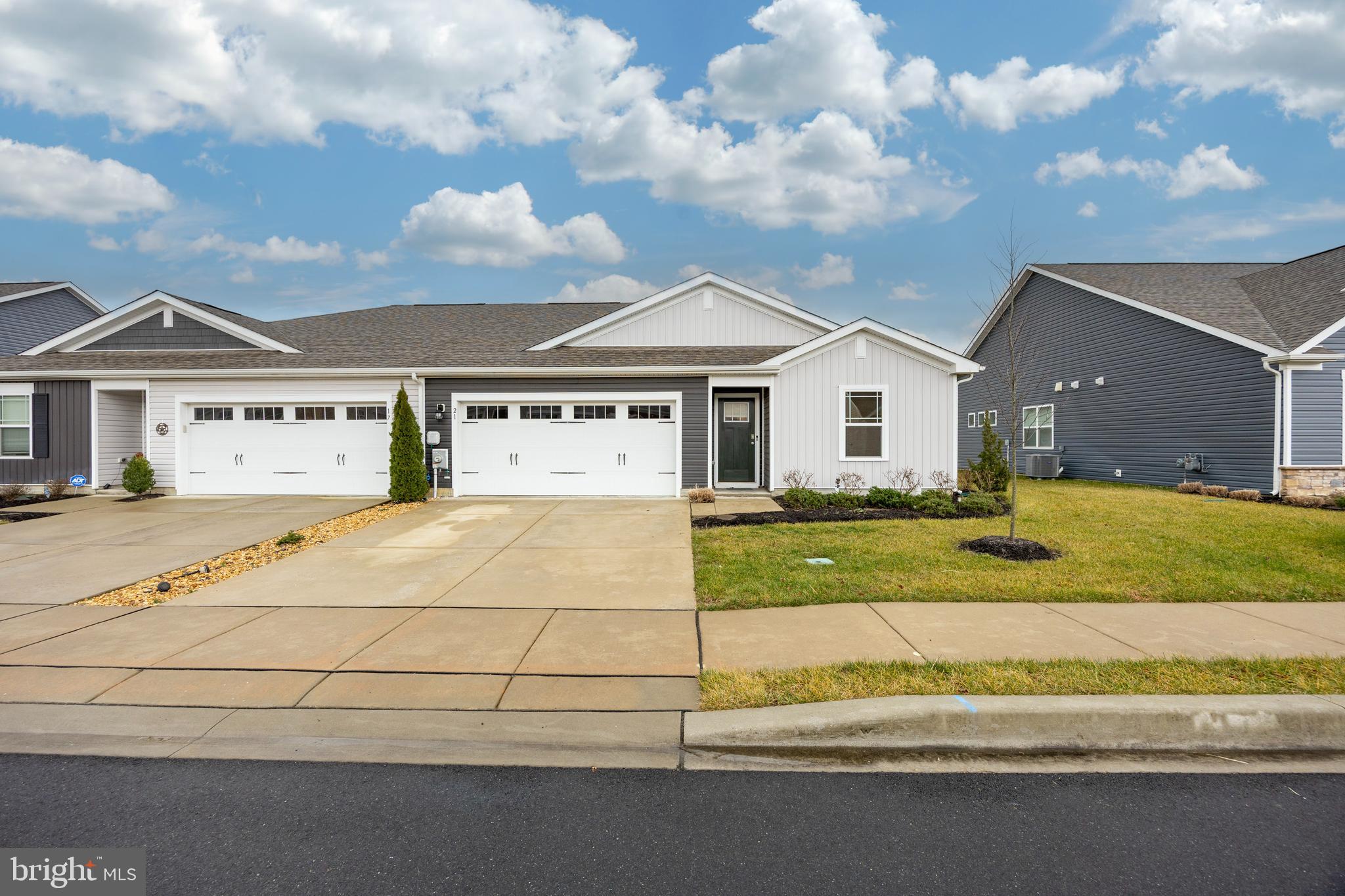 21 Clipper Street Smyrna, DE 19977 - Photo 32 of 39 a view of a white house with a big yard and large trees