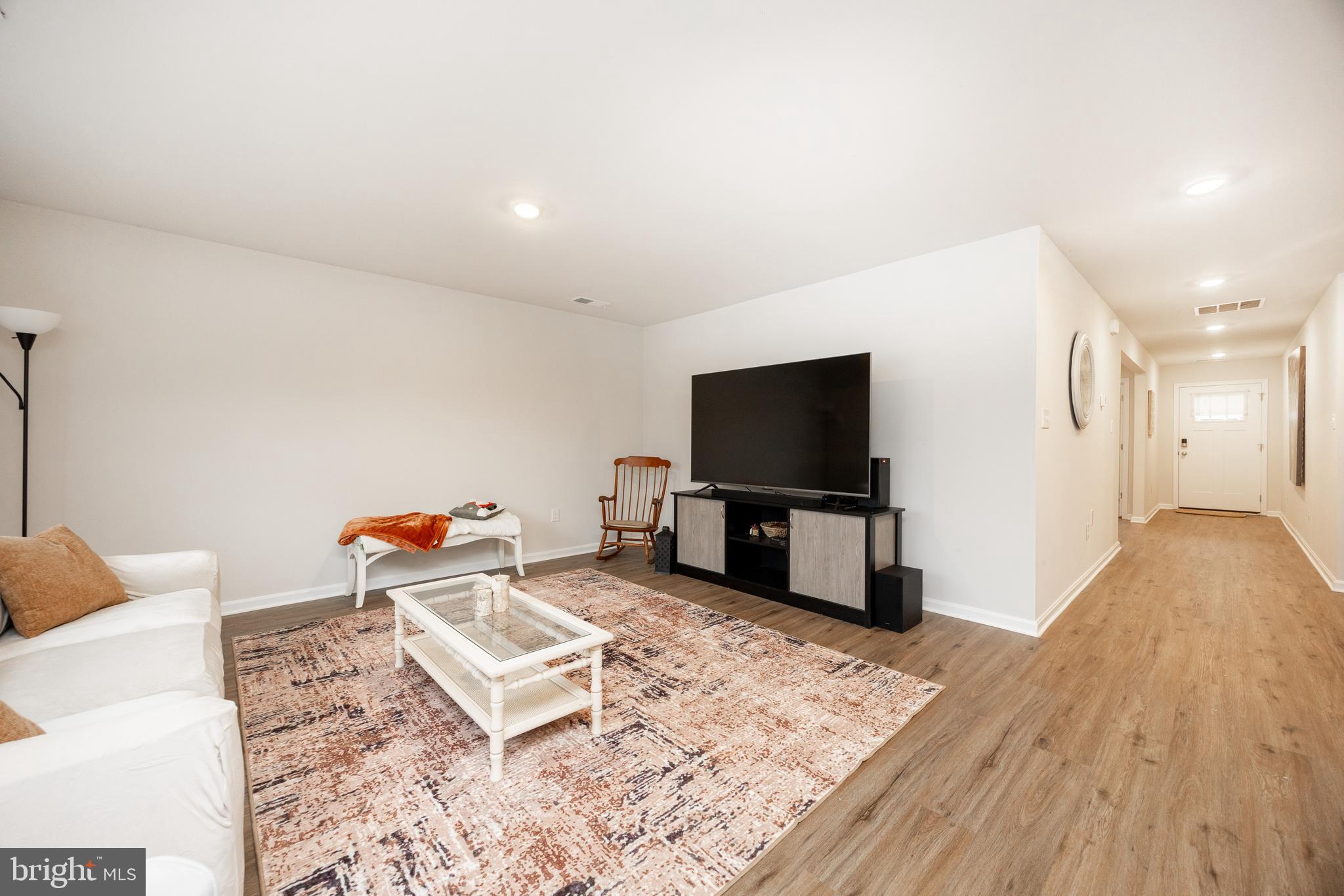 21 Clipper Street Smyrna, DE 19977 - Photo 6 of 39 a living room with furniture and a flat screen tv