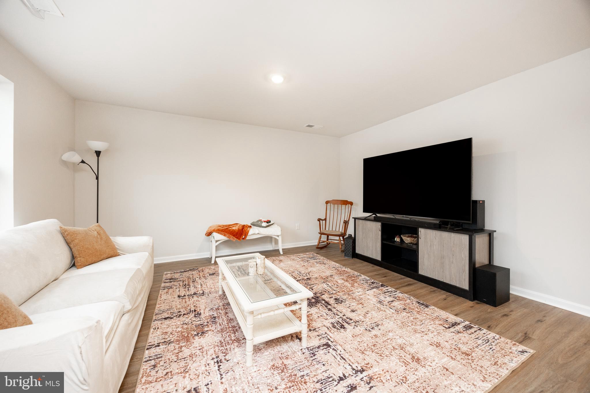 21 Clipper Street Smyrna, DE 19977 - Photo 7 of 39 a living room with a flat screen tv and a couch