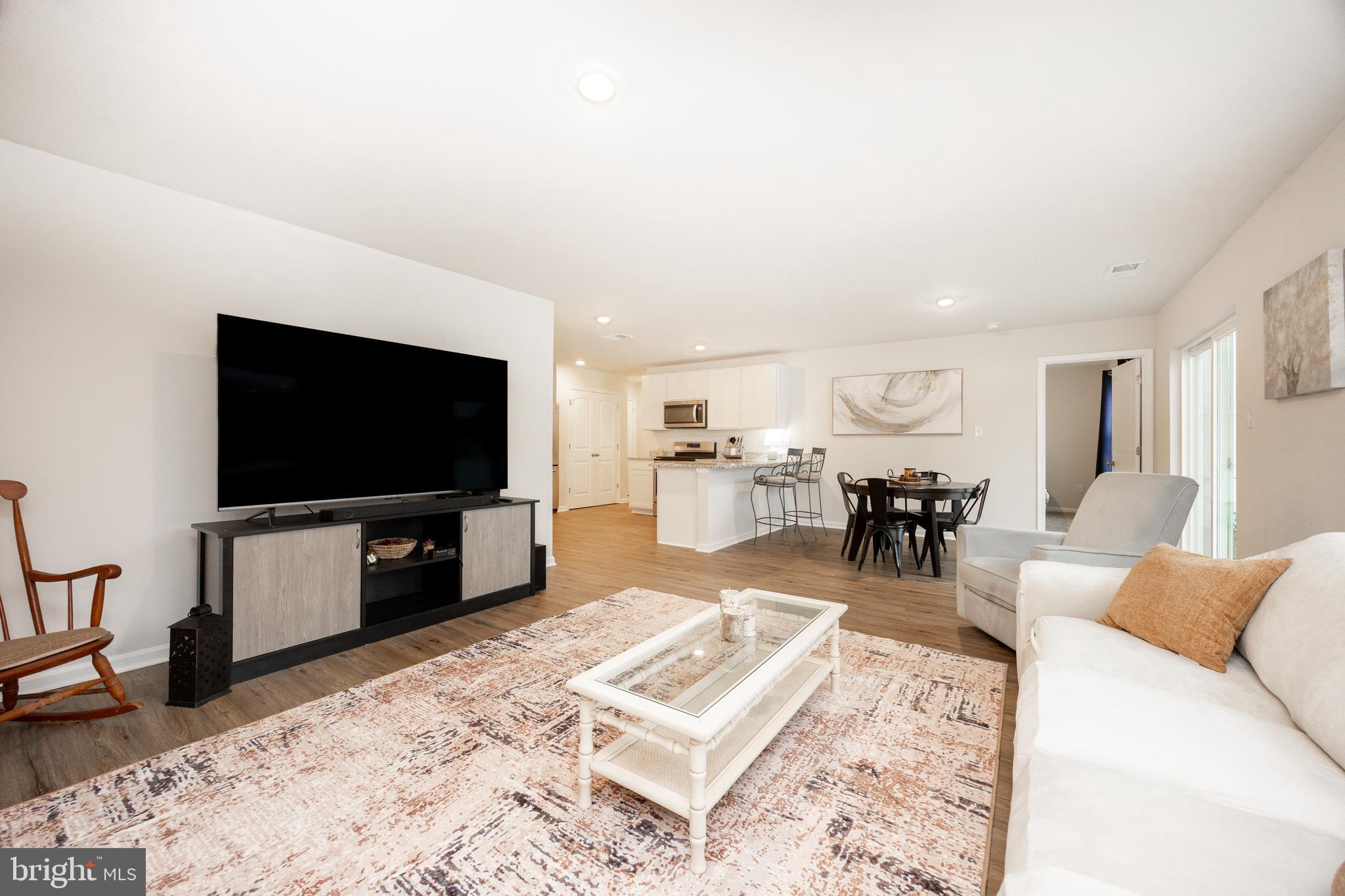 21 Clipper Street Smyrna, DE 19977 - Photo 9 of 39 a living room with furniture and a flat screen tv