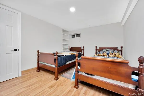 a bedroom with a bed and a dresser