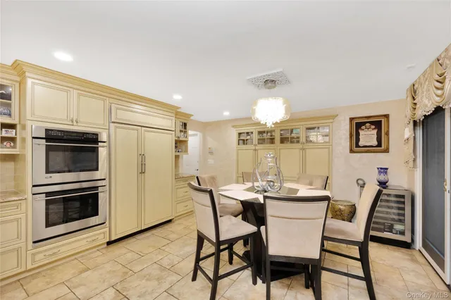 a dining room with furniture and window