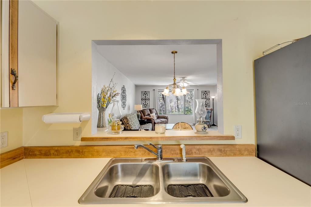 47 Crooked Pine Road Port Orange, FL 32128 - Photo 16 of 41 a kitchen with a sink and a refrigerator