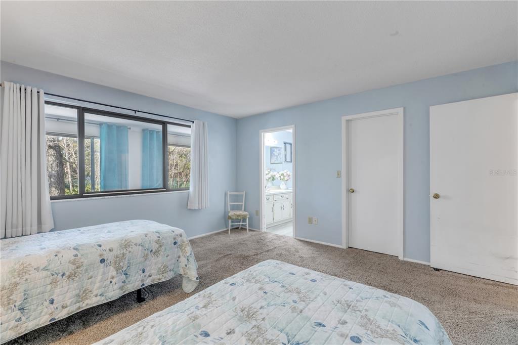 47 Crooked Pine Road Port Orange, FL 32128 - Photo 20 of 41 a bedroom with a large bed and a window