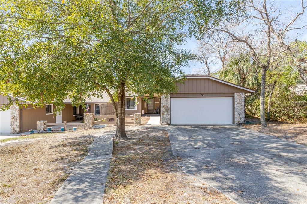 47 Crooked Pine Road Port Orange, FL 32128 - Photo 2 of 41 a house with trees in front of it