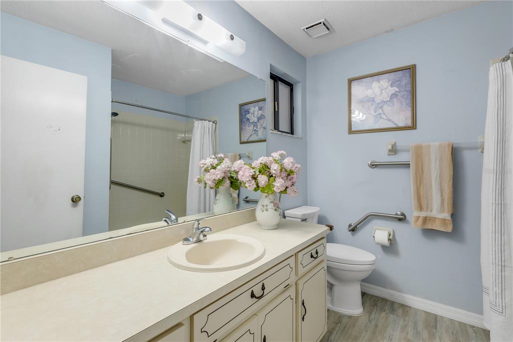 47 Crooked Pine Road Port Orange, FL 32128 - Photo 21 of 41 a bathroom with a granite countertop toilet sink and mirror