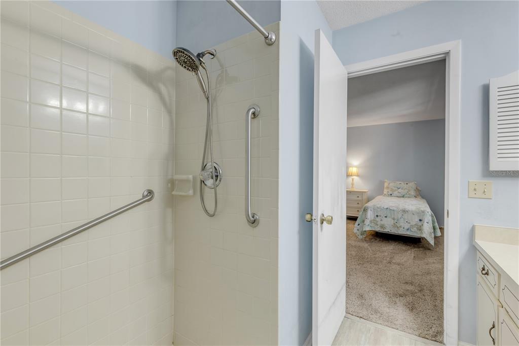 47 Crooked Pine Road Port Orange, FL 32128 - Photo 22 of 41 a bathroom with a granite countertop shower
