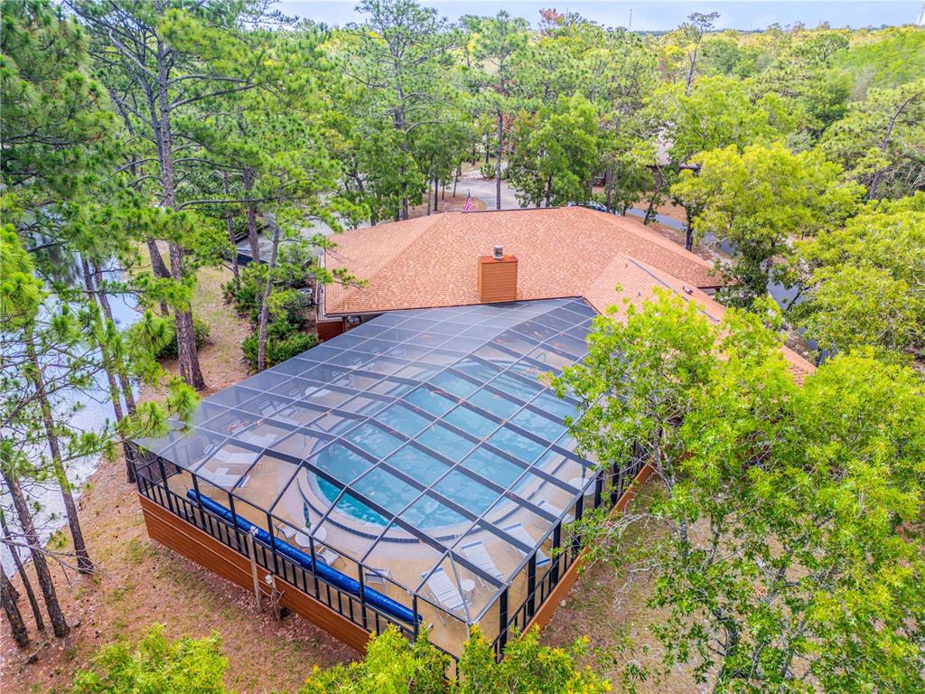 47 Crooked Pine Road Port Orange, FL 32128 - Photo 38 of 41 a aerial view of a house with a yard and a large tree