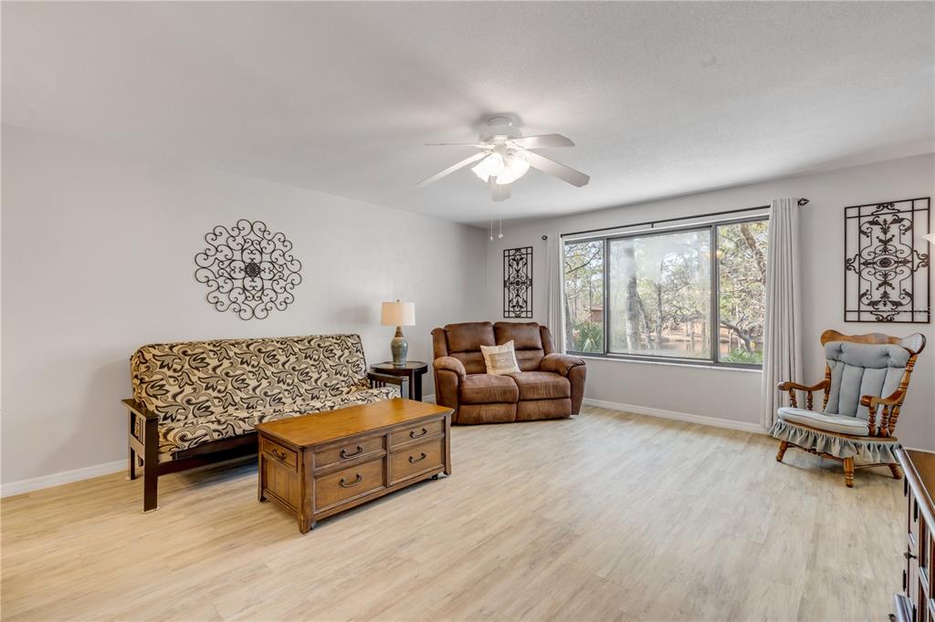 47 Crooked Pine Road Port Orange, FL 32128 - Photo 6 of 41 a living room with furniture and a large window