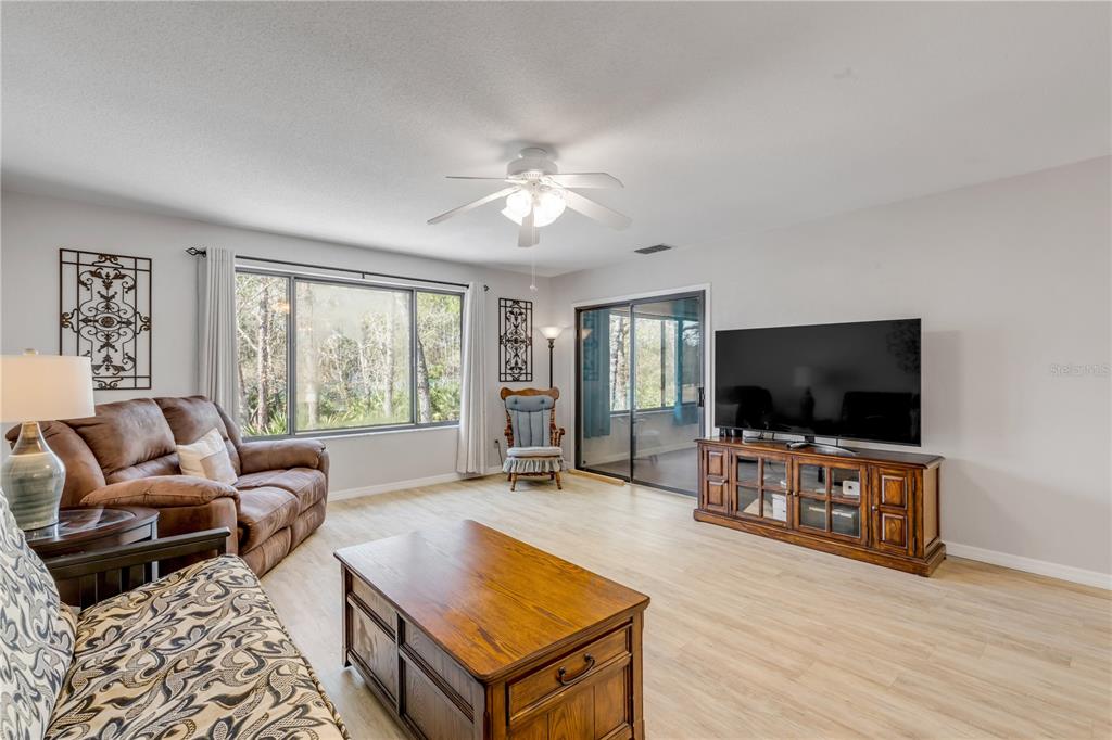 47 Crooked Pine Road Port Orange, FL 32128 - Photo 7 of 41 a living room with furniture and a flat screen tv