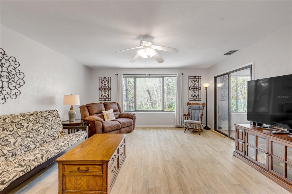 47 Crooked Pine Road Port Orange, FL 32128 - Photo 9 of 41 a living room with furniture and a flat screen tv