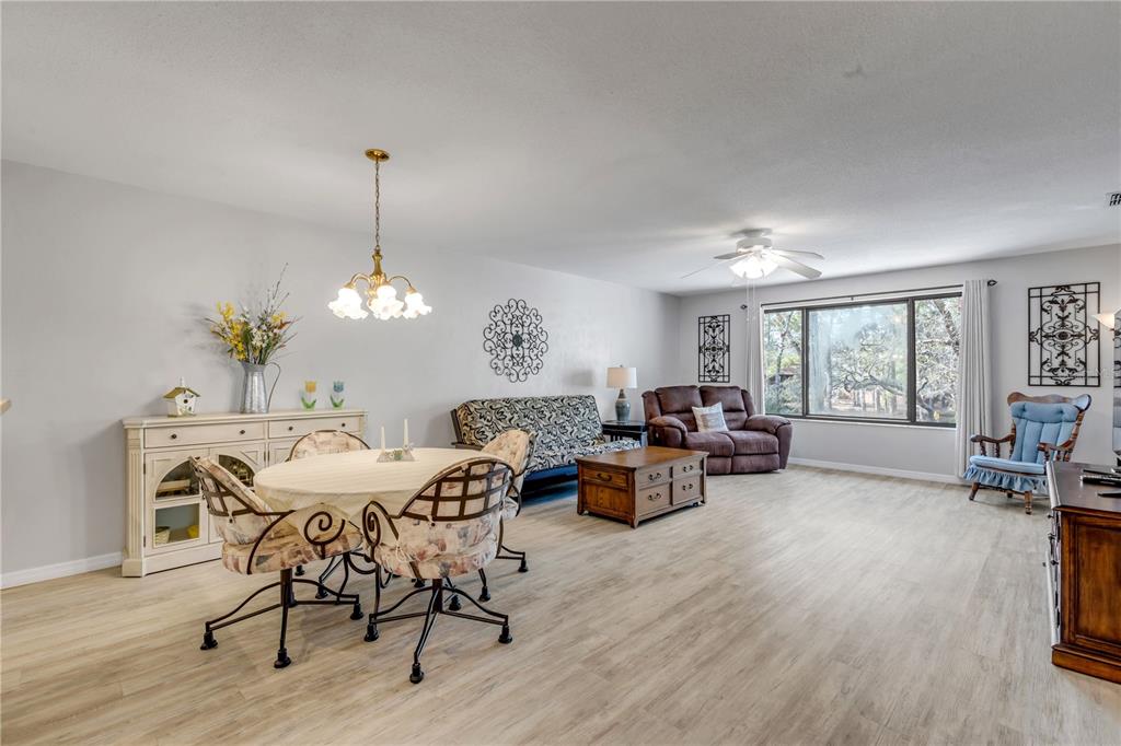 47 Crooked Pine Road Port Orange, FL 32128 - Photo 10 of 41 a view of a dining room with furniture window and wooden floor