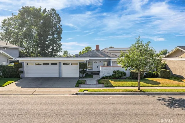 a front view of a house with swimming pool and porch