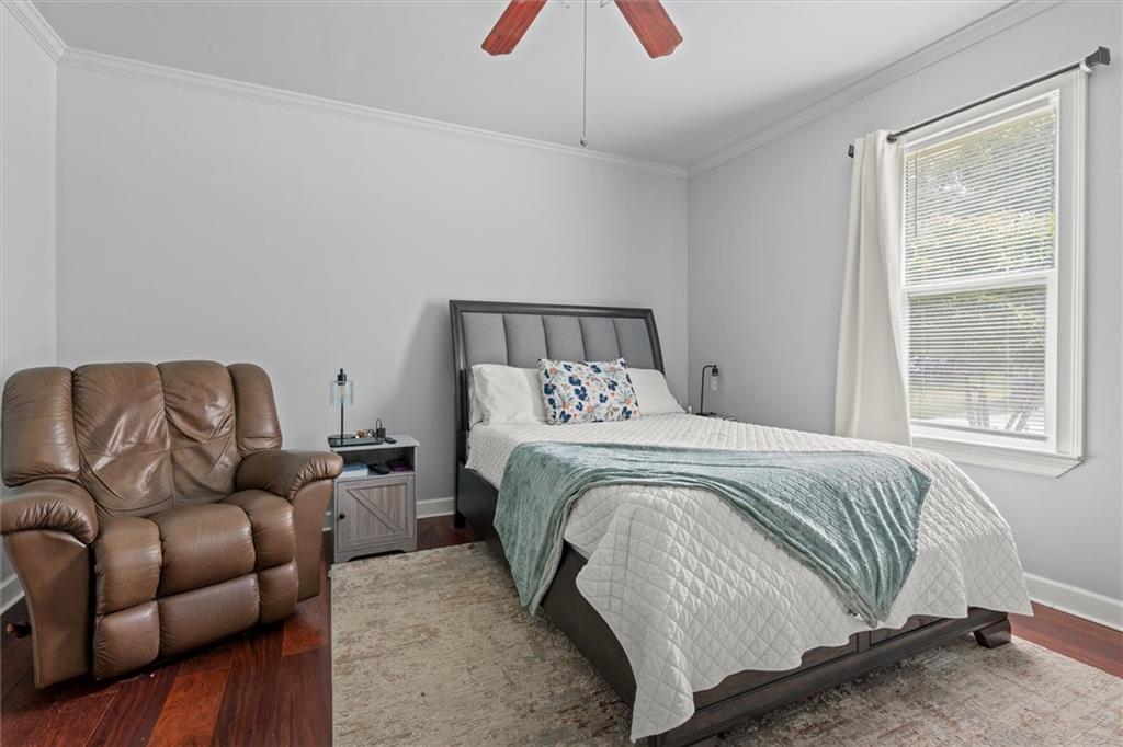 1423 Beulah Church Road Carrollton, GA 30117 - Photo 12 of 31 a bedroom with a bed couch and window
