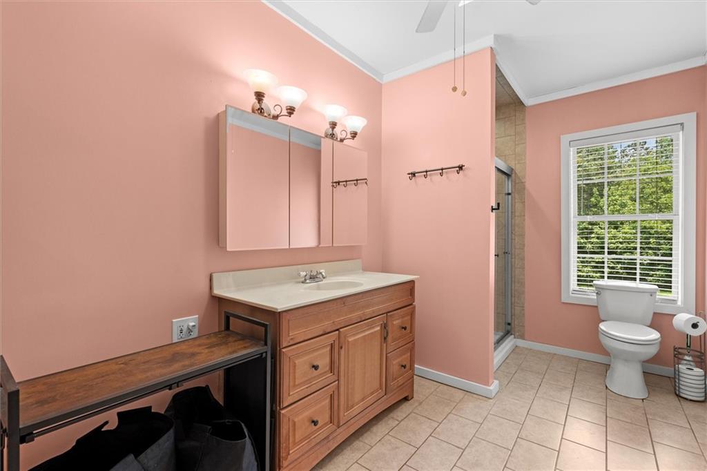 1423 Beulah Church Road Carrollton, GA 30117 - Photo 14 of 31 a bathroom with a sink a toilet and large mirror