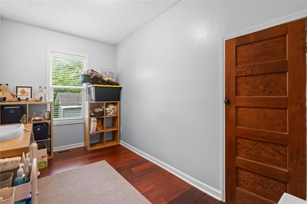 1423 Beulah Church Road Carrollton, GA 30117 - Photo 18 of 31 a view of walk in closet with clothes and shoes