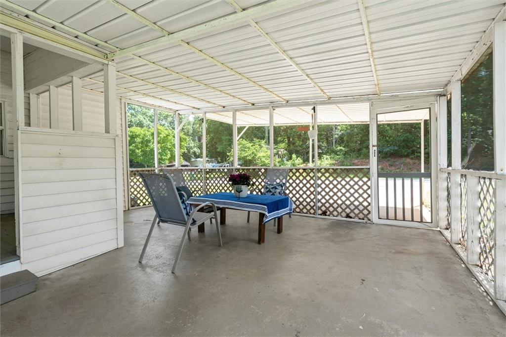 1423 Beulah Church Road Carrollton, GA 30117 - Photo 23 of 31 a view of a patio with a table and chairs