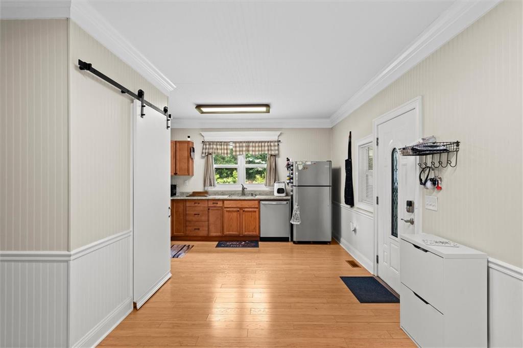 1423 Beulah Church Road Carrollton, GA 30117 - Photo 6 of 31 a kitchen with stainless steel appliances a refrigerator and a stove