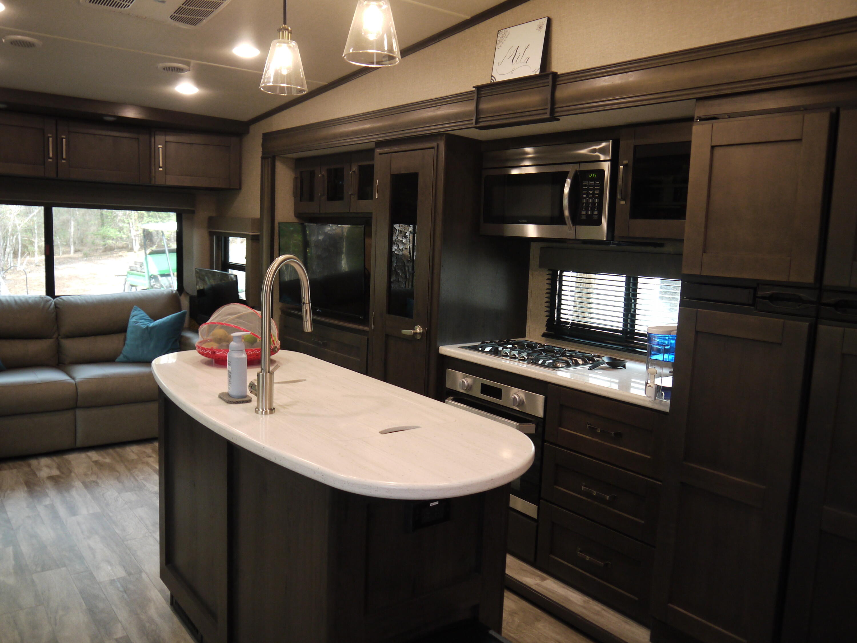 4449 Yellow Bluff Road Crestview, FL 32539 - Photo 25 of 42 a kitchen with stainless steel appliances kitchen island granite countertop a stove a sink and a refrigerator
