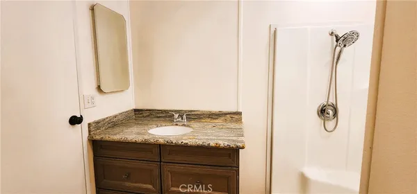 a bathroom with a bathtub and shower