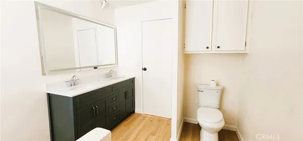 a bathroom with a double vanity sink and a bathtub