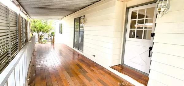 a view of a porch with seating space