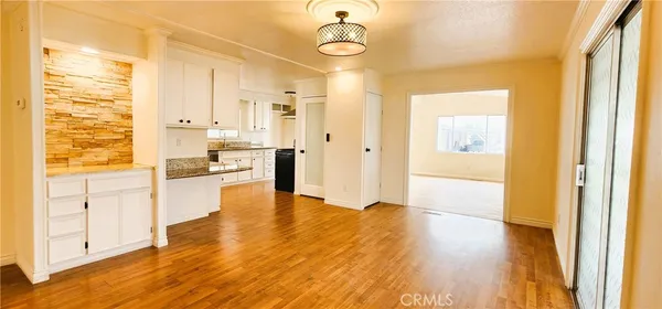 a view of a living room with a wooden floor