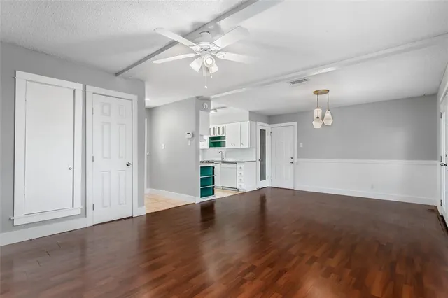 a view of a livingroom with wooden floor