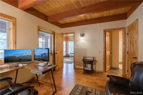 a view of a livingroom with furniture and lounge chair