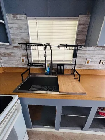 a view of storage and utility room with two washing machine