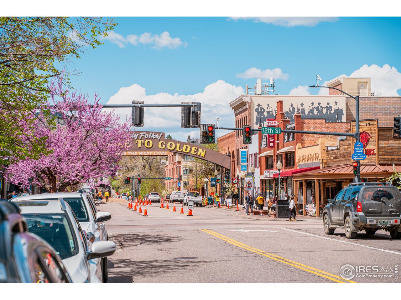 14467 Anvil Way Golden, CO 80403 - Photo 13 of 32 a view of street with shops and parked cars