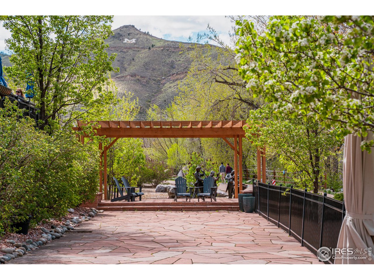 14467 Anvil Way Golden, CO 80403 - Photo 20 of 32 Along the Clear Creek Trail, quiet pockets invite you to pause and unwind-shaded benches, grassy banks, and peaceful overlooks scattered throughout downtown Golden, perfect for resting, lingering, and taking in the soothing sounds of the creek.