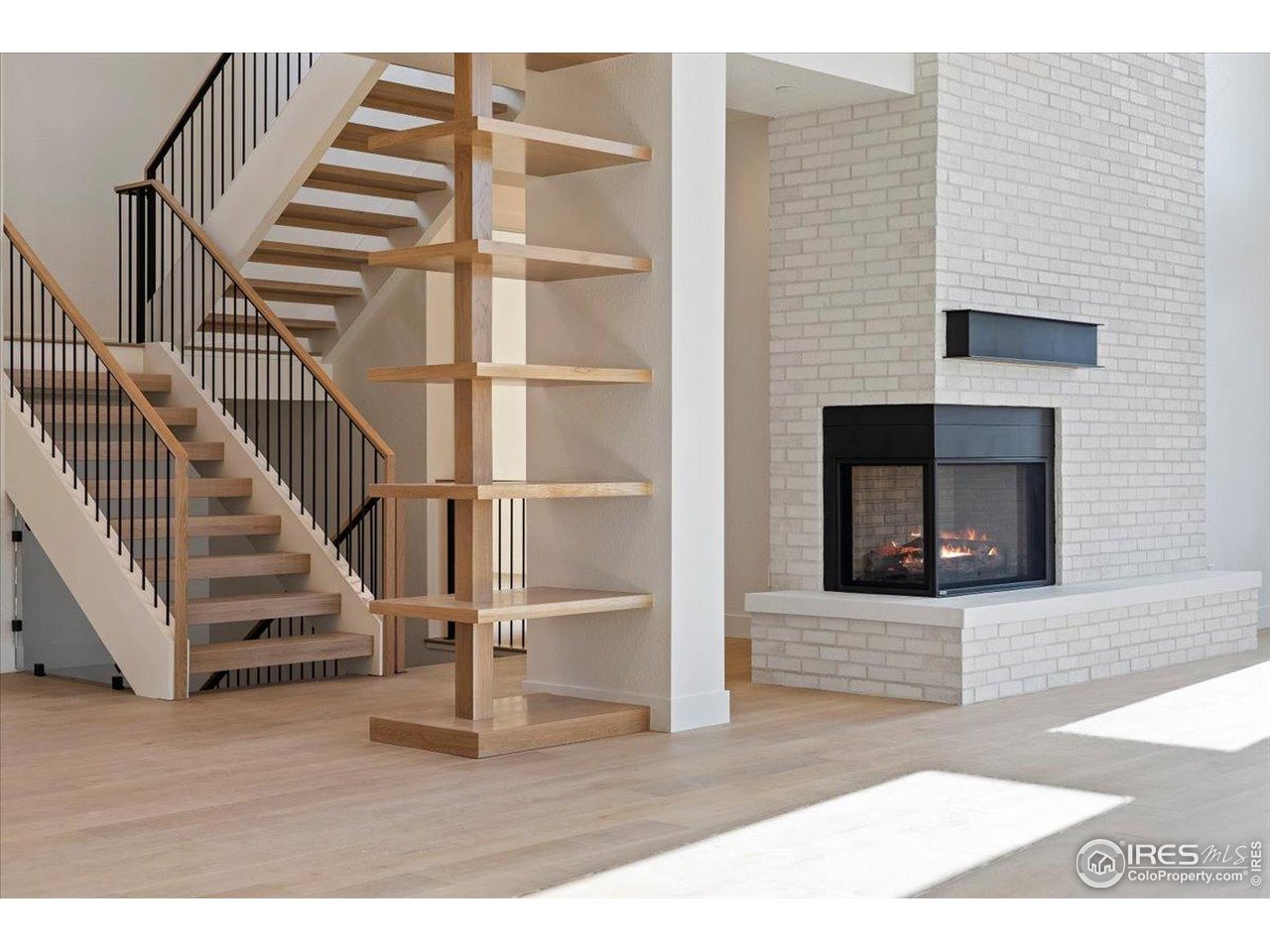 14467 Anvil Way Golden, CO 80403 - Photo 30 of 30 Design-forward details define the living experience-open stair treads, feature walls, and wide, flowing floor plans create rooms filled with volume, natural light, and a sense of effortless modern sophistication.