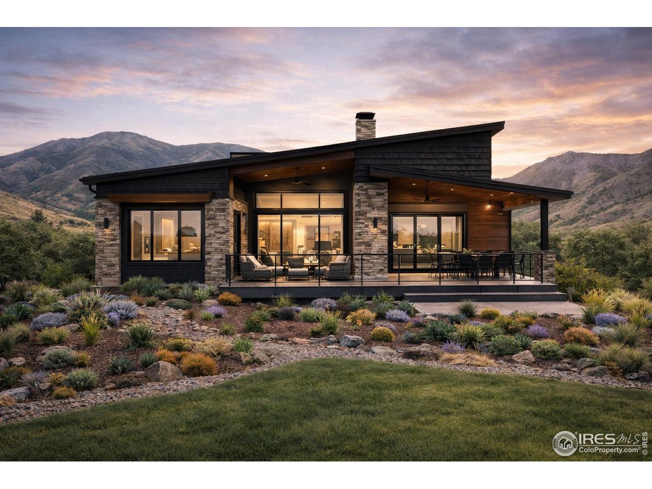 14467 Anvil Way Golden, CO 80403 - Photo 8 of 32 a view of a house with a small yard and wooden fence
