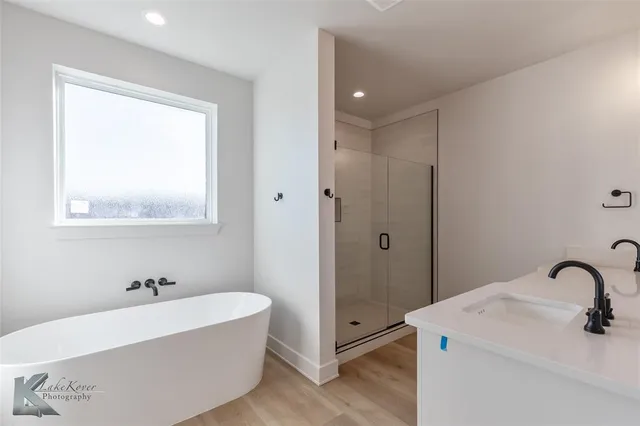 a view of an house with backyard space and balcony