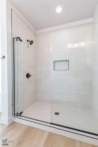 an aerial view of a house with garden space and street view