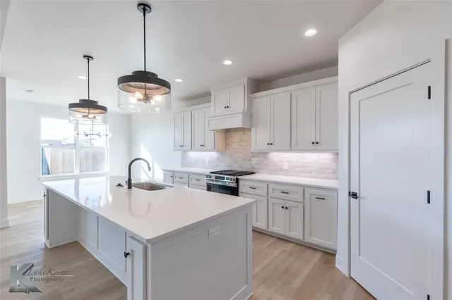 a bathroom with a bathtub and sink