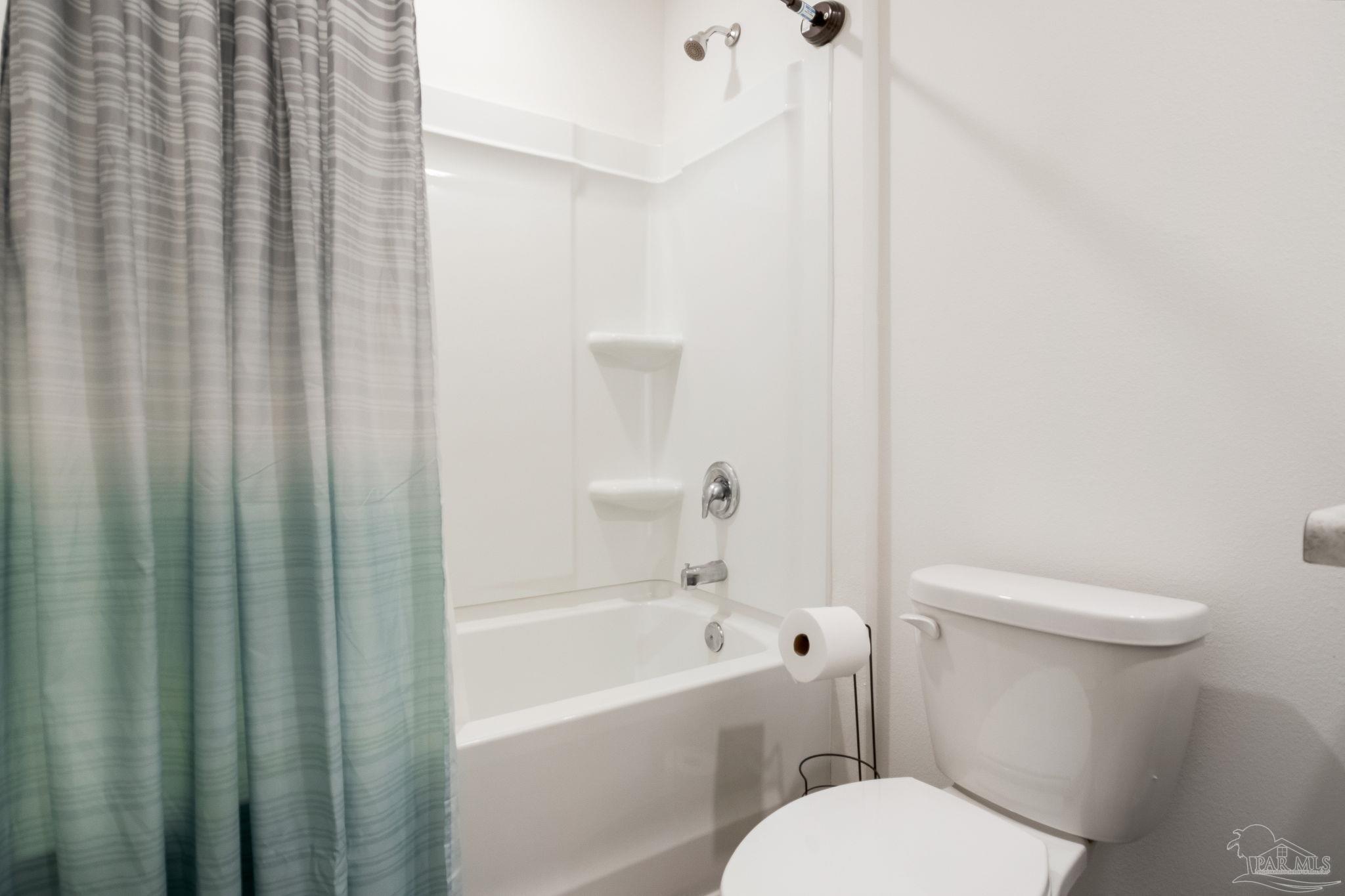 1625 Addies Way Pensacola, FL 32534 - Photo 37 of 50 a white toilet sitting next to a bath tub