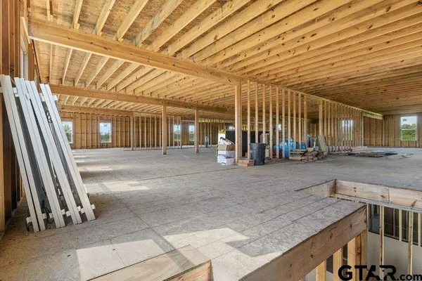 a view of a hall with wooden floor