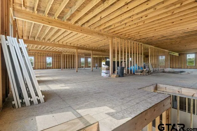 a view of a hall with wooden floor