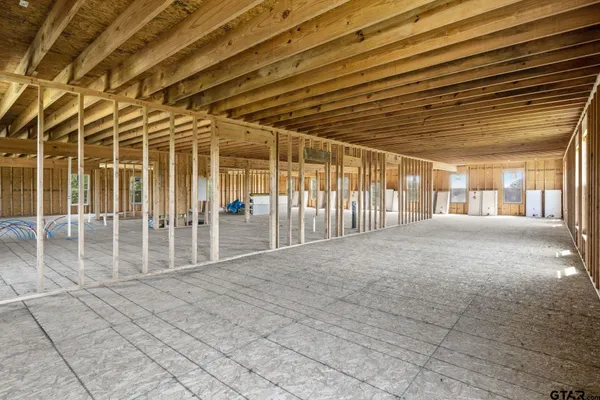a view of a hallway with seating area