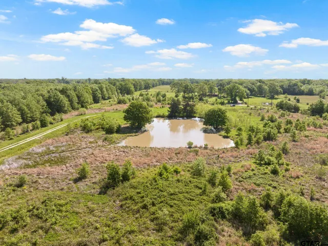 a view of a lake with sunset