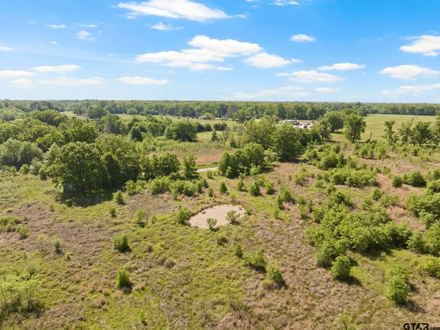 a view of a yard with an ocean