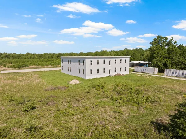 a view of a garden with an ocean view