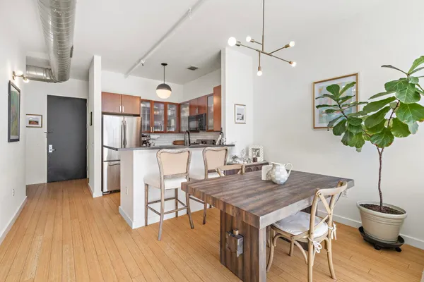 a kitchen with a table and chairs in it