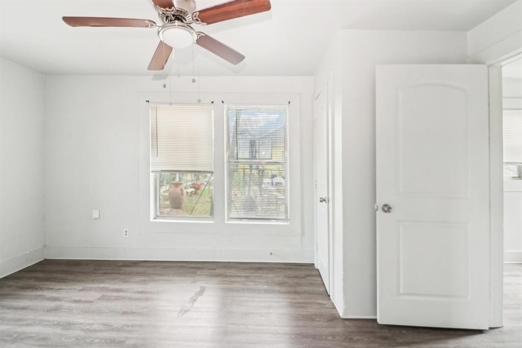 1906 Grainger Street Fort Worth, TX 76110 - Photo 10 of 38 Unfurnished bedroom featuring ceiling fan and hardwood / wood-style flooring